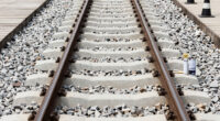 Painting The Sides Of Railroad Rails White To Reduce Derailment